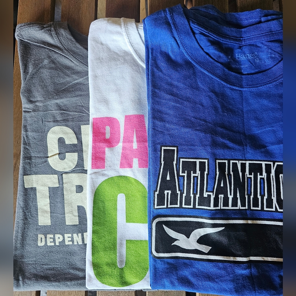 Three souvenir T-shirts size M